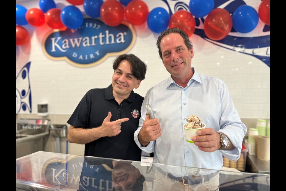 Halibut House Bradford's Khurram Sultan Khwaja with MP Scot Davidson at the grand opening of the Kawartha Dairy ice cream addition to the restaurant