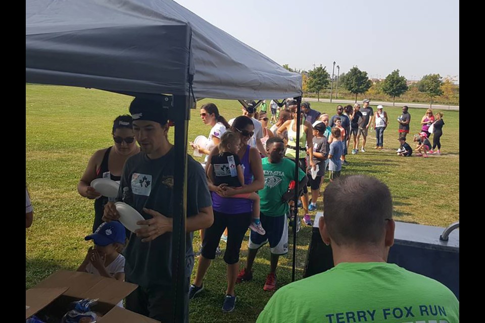 Participants line up for a free barbecue after the 2017 Terry Fox Run. Contributed phto