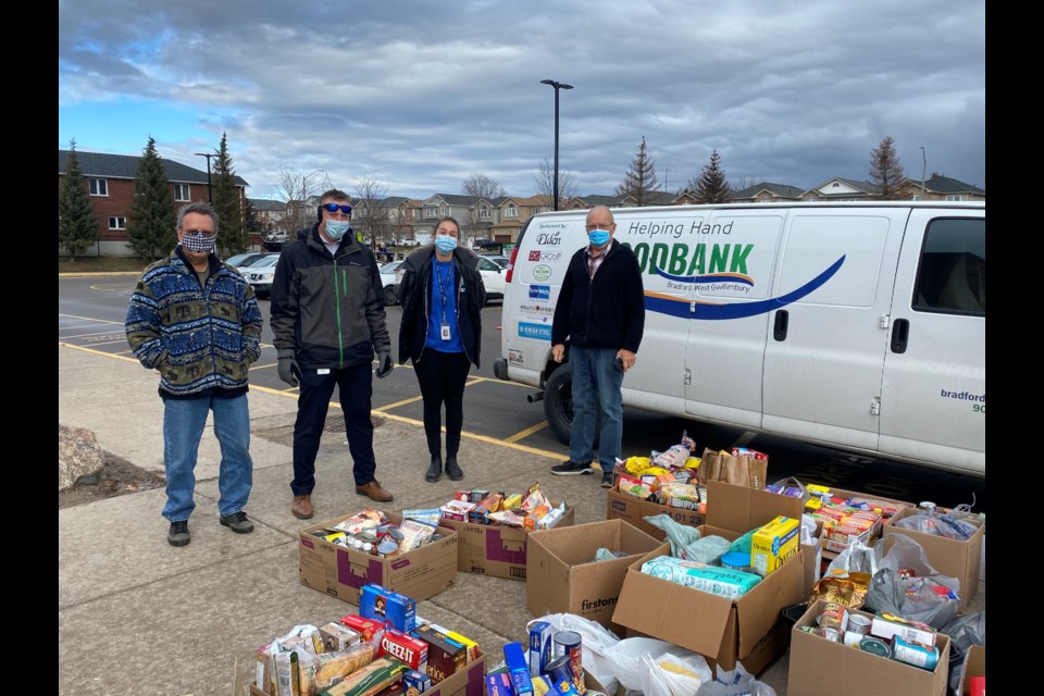 Food bank volunteer Gary Cottingham, Fieldcrest Vice Prinicipal Martin Orr, Fieldcrest teacher Michelle Major and Food Bank volunteer Bill Jermyn