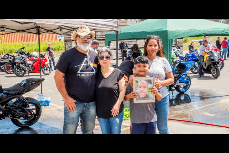 Javier's family at the charity wash.  Paul Novosad for BradfordToday.