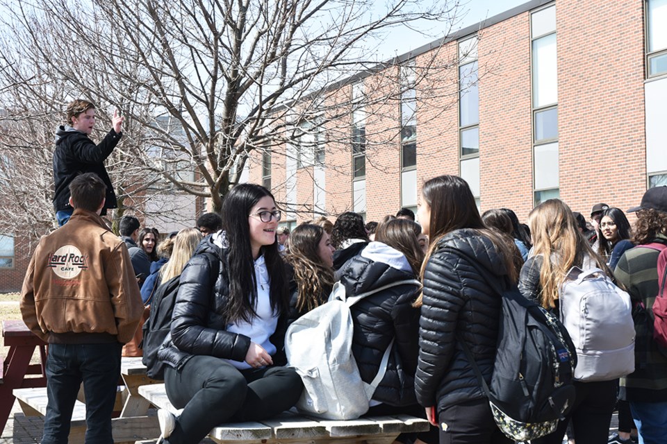 Students leave the classrooms and rally outside Bradford District High School on Thursday. Miriam King/Bradford Today