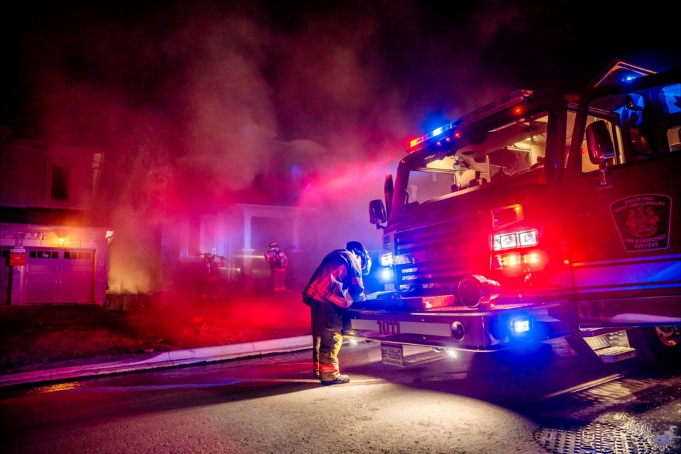 'Accountability' is set up on the front of the home to keep track of all firefighters.