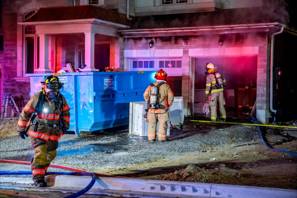 Bradford Fire Captian Mike Kachman checks for fire extensions.