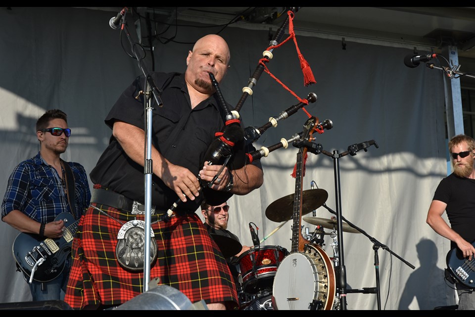 Mudmen co-founder Sandy Campbell plays the bagpipes during the Celtic band's performance at Wednesday night's  Music in the Park series finale. Miriam King/Bradford Today