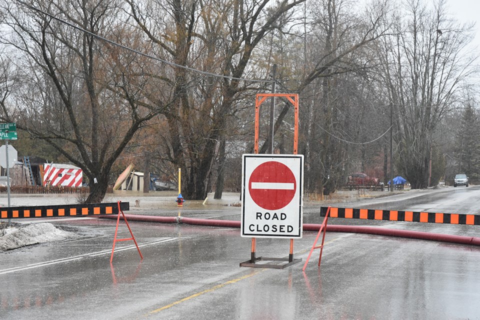 Maple Road in Belle Ewart, Innisfil, was closed to allow town staff to pump down the floodwaters. Miriam King/Bradford Today