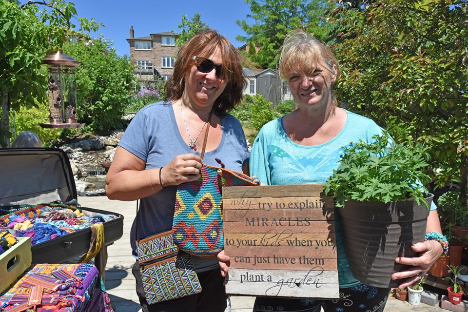 Marcia Talbot, left, and Barb Watson at the plant sale. Miriam King/Bradford Today