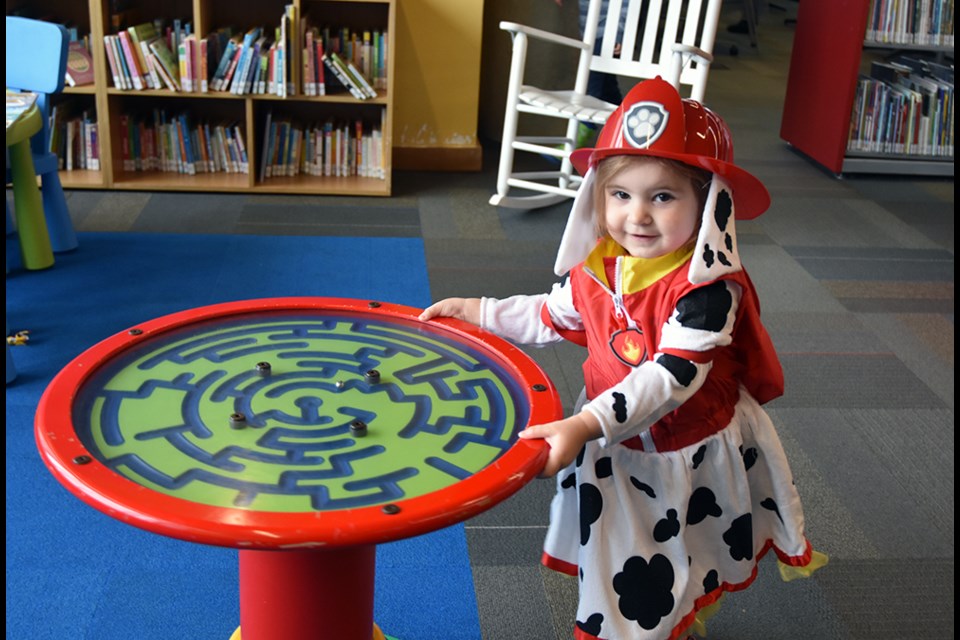 Brielle, two, was a perfect Sparky the Fire Dog at the library. Miriam King/BradfordToday