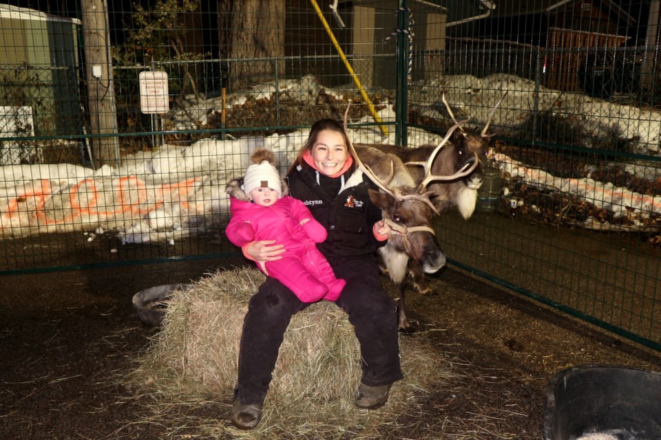 Ashtynn and her baby girl, Lilah get up close with Santa’s reindeer. Natasha Philpott/BradfordToday                          