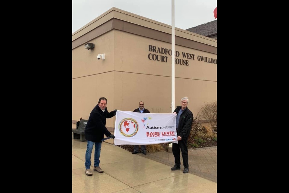 MP Scot Davidson, Coun. Raj Sandhu and Mayor Rob Keffer get ready to raise the Autism Awareness flag outside the Bradford courthouse on Sunday morning. Submitted Photo