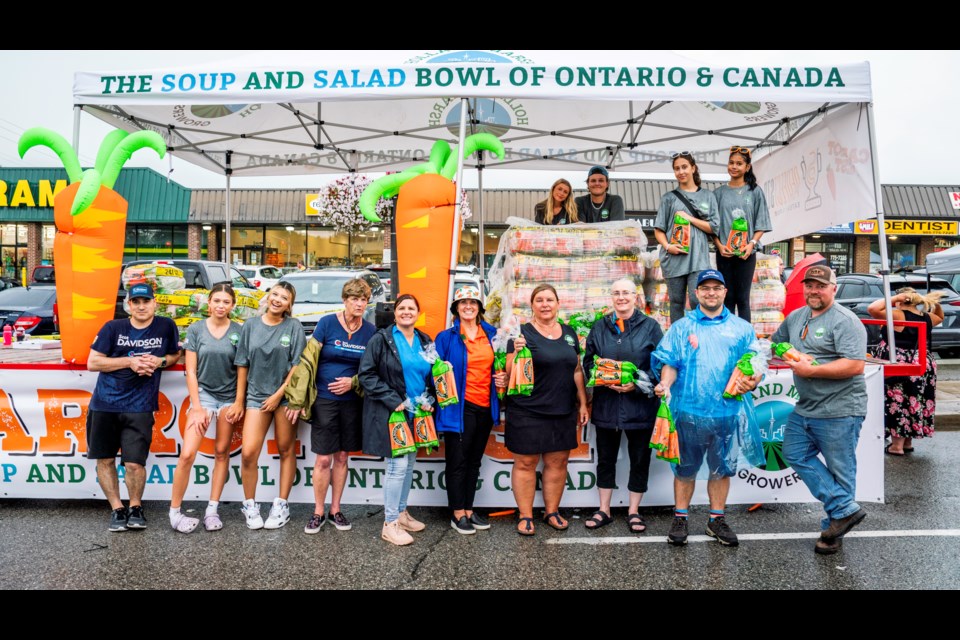 Jody Mott, the Holland Marsh Growers Assn. friends and volunteers handed out tons of carrots during Carrot Fest