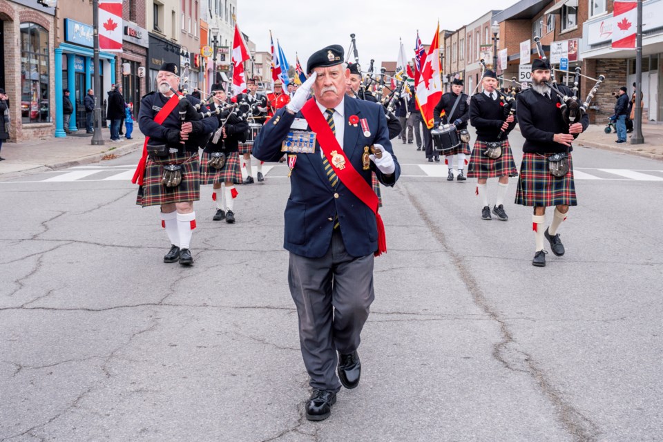 Mike Giovanetti, past president of Royal Canadian Legion Branch 521, leads the parade down the main street of Bradford to the cenotaph service.