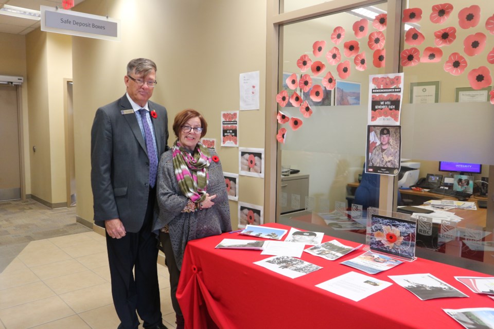 Wayne Brakeboer and Francine Grenon of RBC Bradford stand by their Rememberance Day display. Natasha Philpott/BradfordToday                               