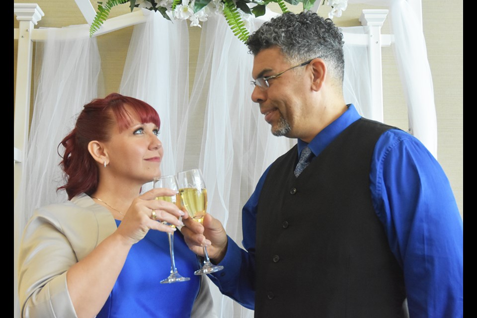 Newlyweds Tiffany and Raymond share a toast at Innisfil's Town Hall. Miriam King/Bradford Today