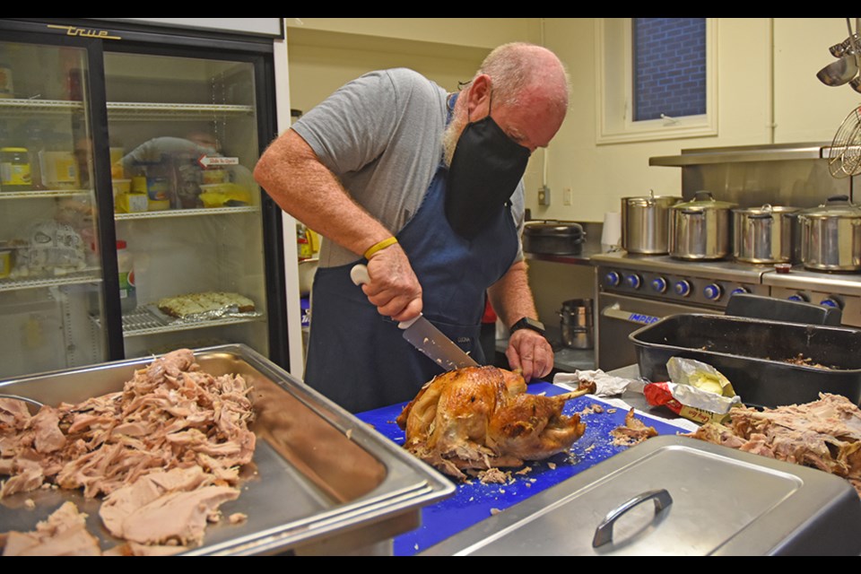 Gavin Maclean cooks up and carves Thanksgiving turkeys at the Bradford Legion's Friday Night Social. 