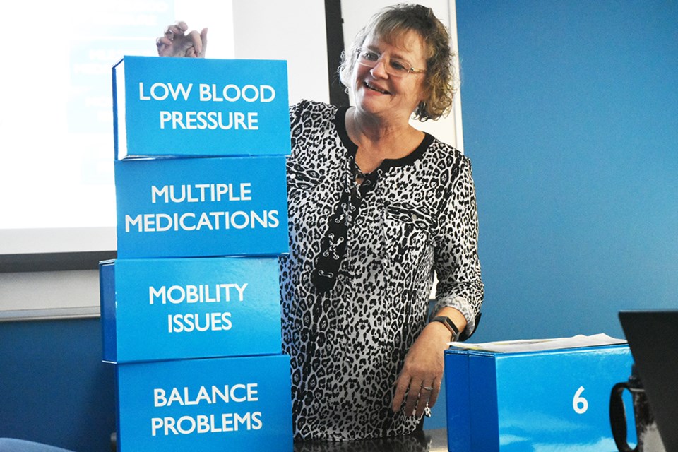 Linda Ind begins to build a 'Tower of Risk,' identifying the factors that can lead to falls. Miriam King/Bradford Today