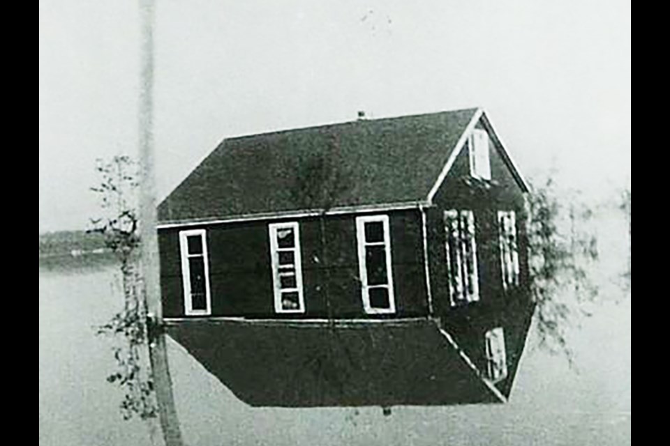 The flooded home of Sjoerd van der Kooi, in the Holland Marsh. Photo from the BWG Public Library Archives. 