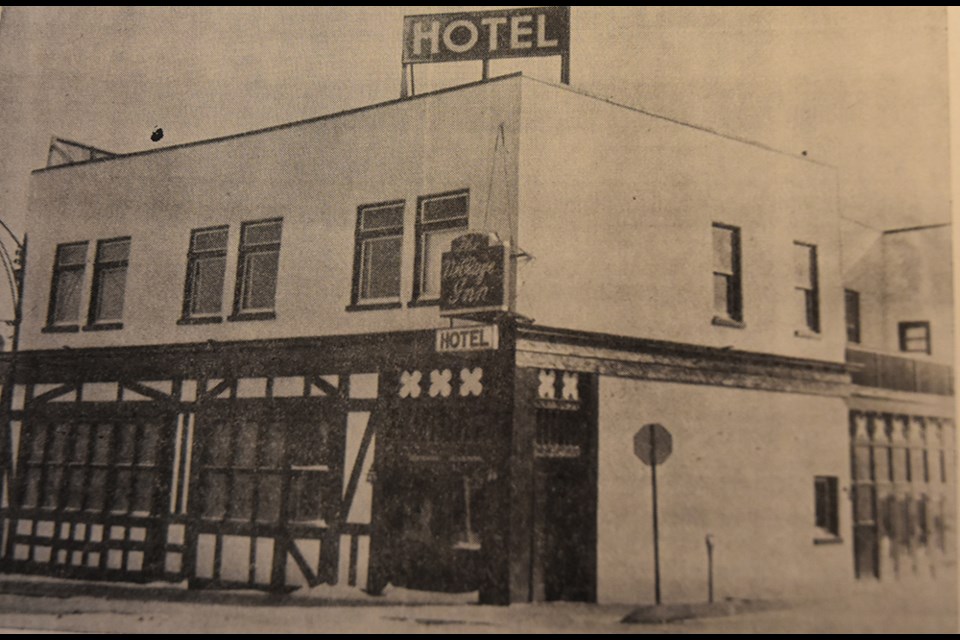 Archival photo of The Village Inn in Bradford, with paired windows and  Tudor half-timbering. BWG Public Library Archives