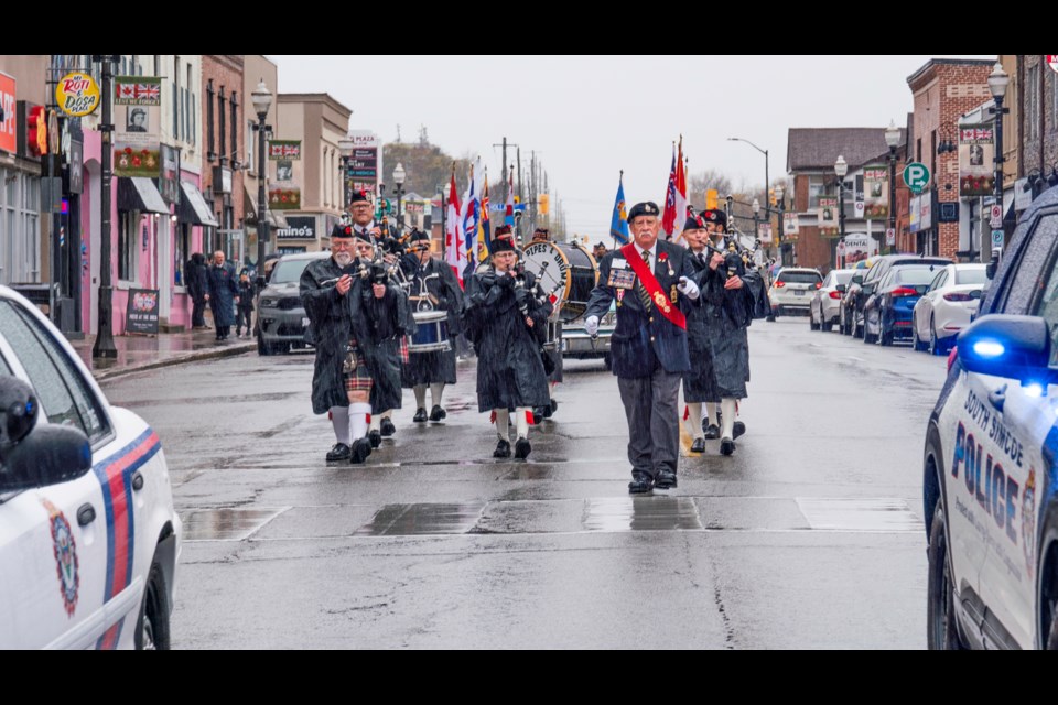 Mike Giovanetti, former past president of the Royal Canadian Legion Brand 521 leads the parade down the main street of Bradford to the cenotaph service.