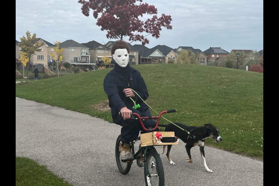 Jeremey Staniewski is the man behind the Michael Myers mask who drives around town on his bike with his dog Tito. 