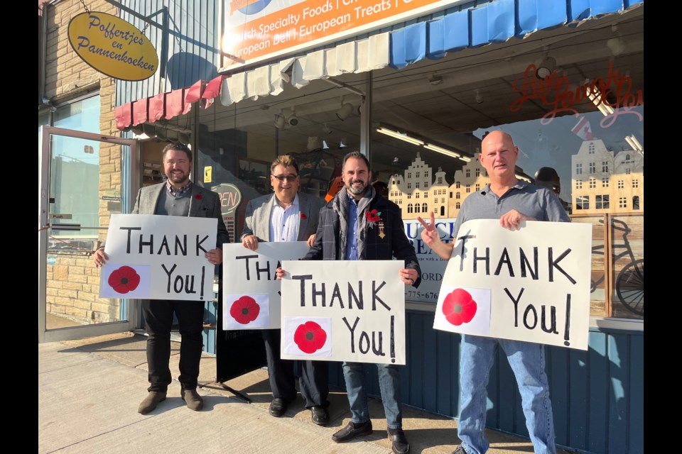 Councillors Jonathan Scott, Peter Dykie and Councillor-elect Nickolas Harper were out on Thursday handing out Thank You signs to local businesses in the downtown core ahead of the Remembrance Day parade on Sunday