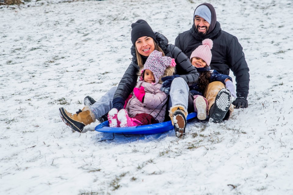 The Morales family sledding down “Deadman’s Hill” behind St. Jean de Brebeuf School