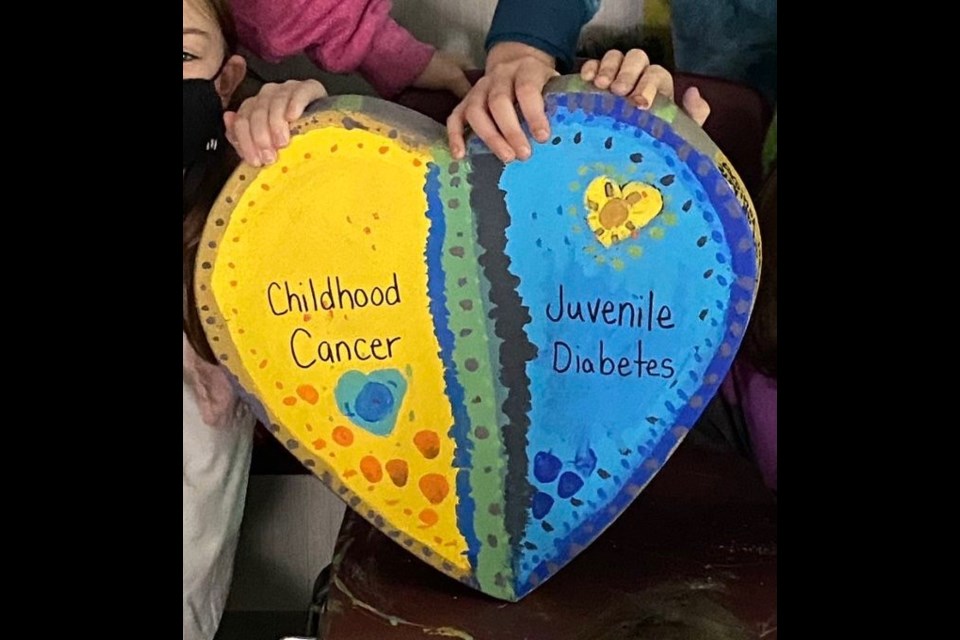 Students at Fieldcrest Elementary Public School took on the 'Painted Heart Project' challenge presented by the Bradford Lion's Club, painting the theme for Childhood Cancer and Diabetes as a class.  /Photo Submitted 