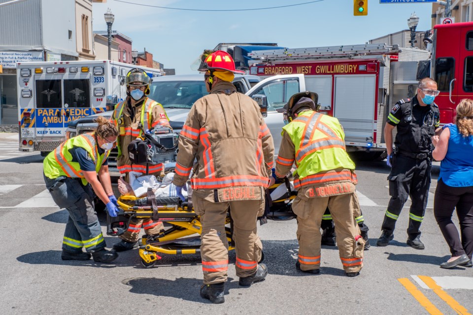 First-responders prepare a patient for transport to Southlake Hospital on Monday. Paul Novosad for BradfordToday