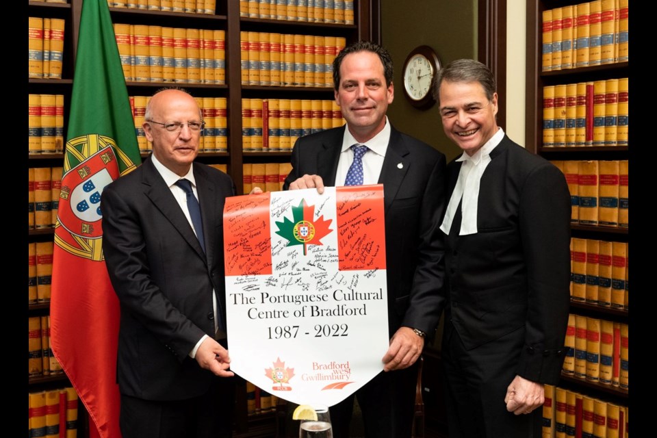 MP Scot Davidson presents Augusto Santos Silva, President of the Assembly of the Republic of Portugal with a pennant signed by members of the Portuguese Cultural Centre of Bradford