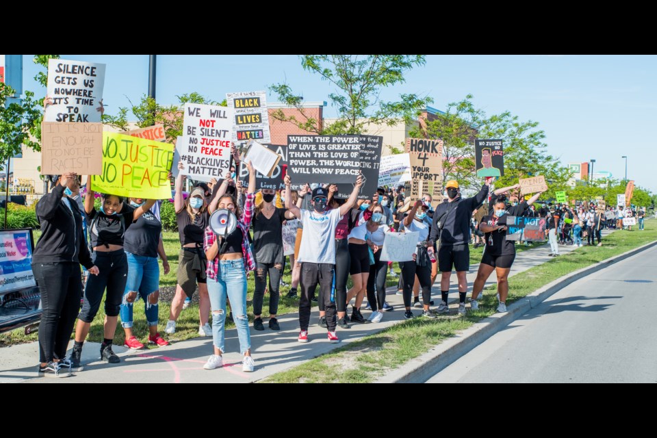 Over 100 people marched along Holland St. West in support of the BLM Movement protest organized by Aliza Pasha. Paul Novosad for Bradford Today.