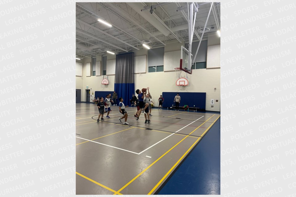 In SSBC's Under 12 league at Harvest Hills P.S., David R goes for the layup. 