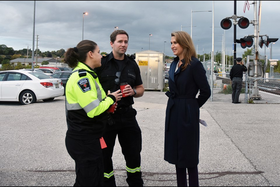 Ontario Minister of Transportation Caroline Mulroney, right, chats with Simcoe County Paramedics Justin Rae and Chantelle Mullane at the Bradford GO station. Miriam King/Bradford Today