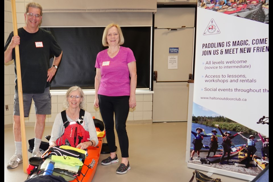 The Halton Outdoor Club organizes paddle trips and new paddlers can take a variety of safety and rescue courses by Paddle Canada instructors. Here, club members (from left) Bob Annis, Lise Sorensen and Anne Herbert-Grouchy show visitors one of their kayaks.