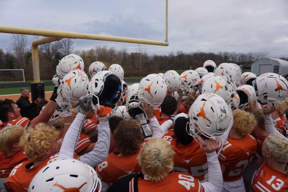 The Longhorns celebrate their victory at home.                                