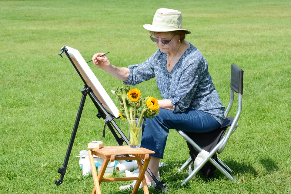 Art Walk 2024 took place at Burloak Waterfront Park on Saturday. Painting sunflowers is Megale Vrillard of Burlington.