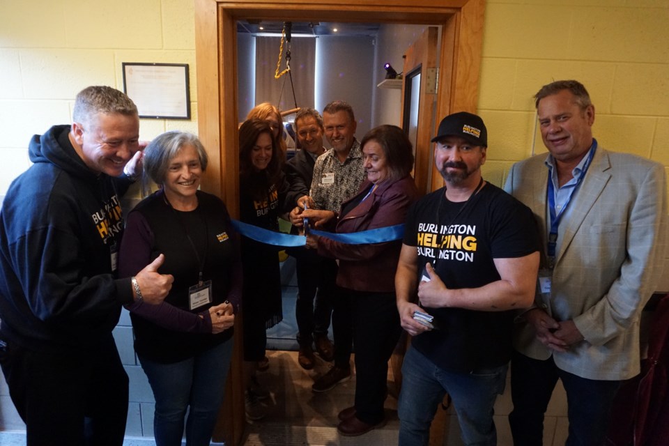 Representatives from Woodview, Burlington Helping Burlington and the City of Burlington were on hand on Tuesday afternoon to cut the ribbon on the new room.