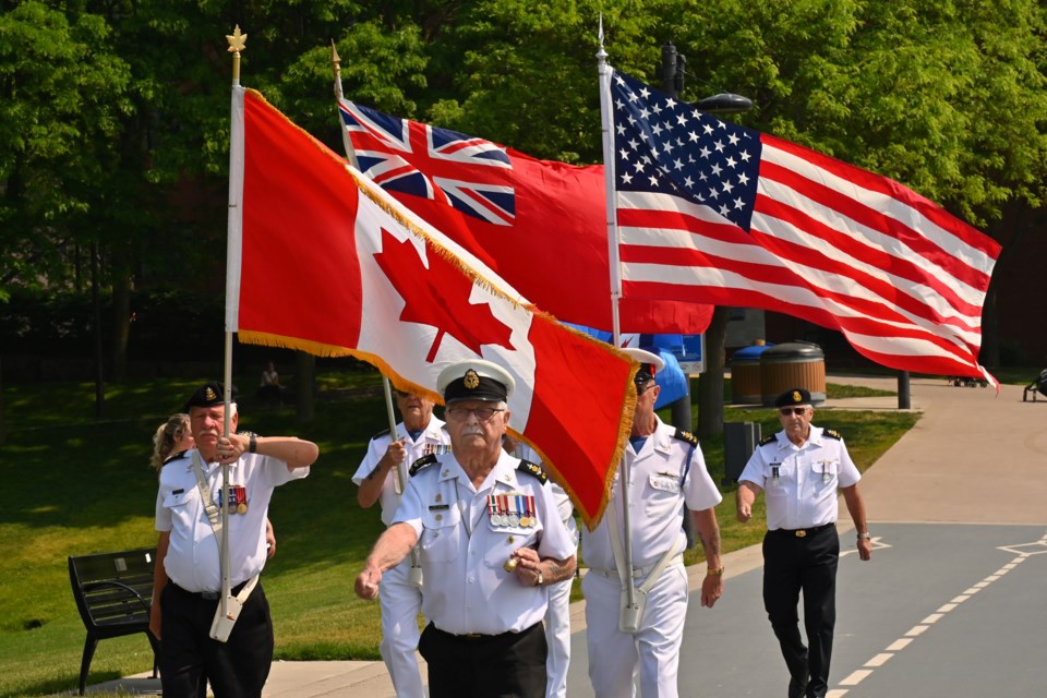 The colour party advances at the D-Day remembrance ceremony at Spencer Smith Park June 6. 