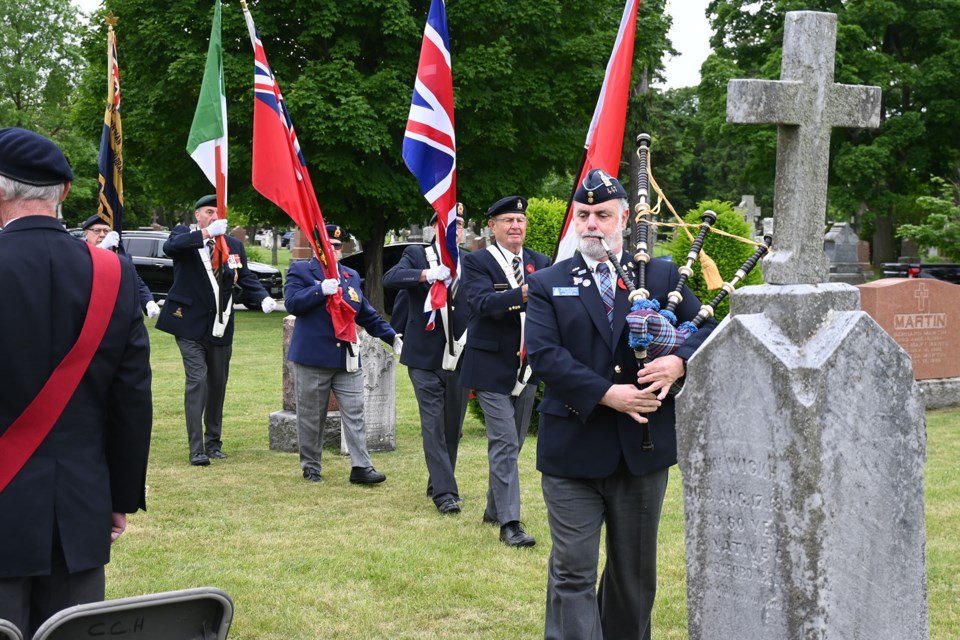 A colour party and piper were present to honour Private John McGovern.