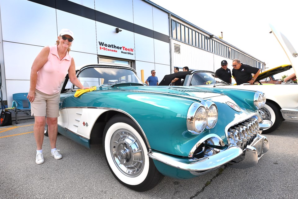 Performance Auto Show and Shine held its annual open house at 1164 Walkers Line on Sunday with parts, lubricants, new FAST wheels and more than 200 vehicles. The event was also sponsored by Weather Tech. Susan Gilbey of Oakville shines up her 1958 Corvette.