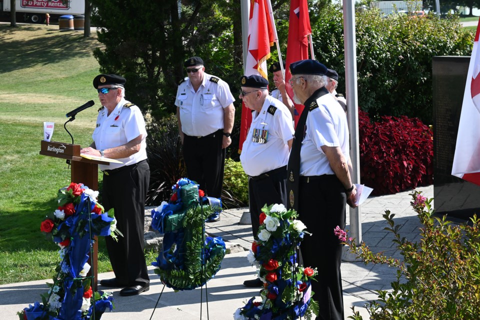 Ian Greaves reads out a poem remembering the Merchant Marines who lost their lives in the Second World War.