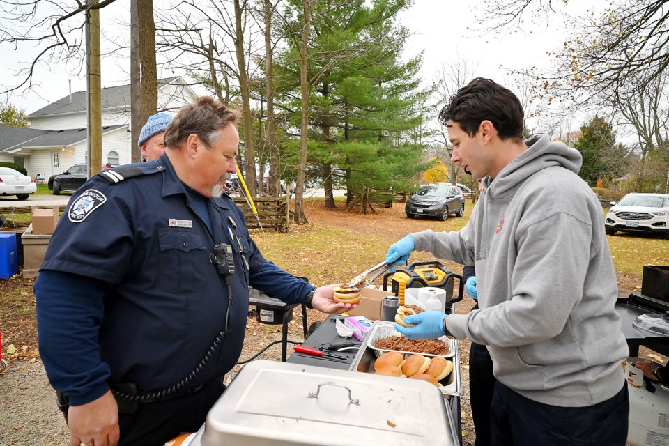 A spectacular Kilbride Christmas Makers Market was held at Kilbride United Church on Saturday. 
Patrick Marcoux, right, serves a burger to Scott Dynes, Kilbride Volunteer Firefighters' Association.