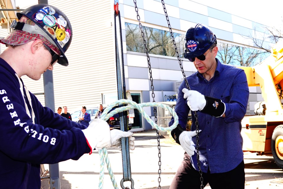 Liam White shows Conservative Leader Pierre Poilievre the ropes - literally. 