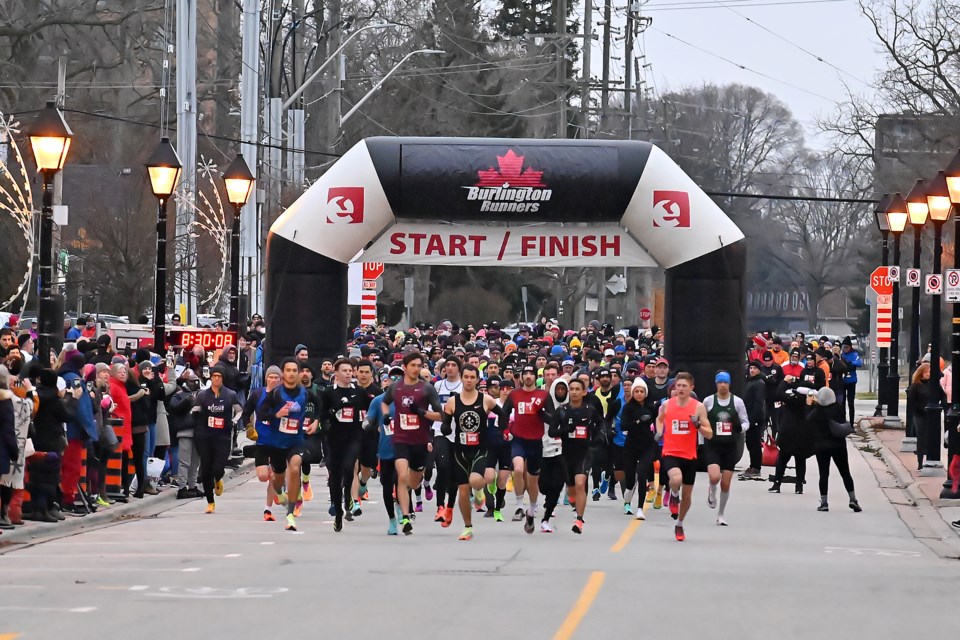 Robbie Burns Race participants take off from the starting line at the Burlington Performing Arts Centre Sunday morning (Jan. 22).