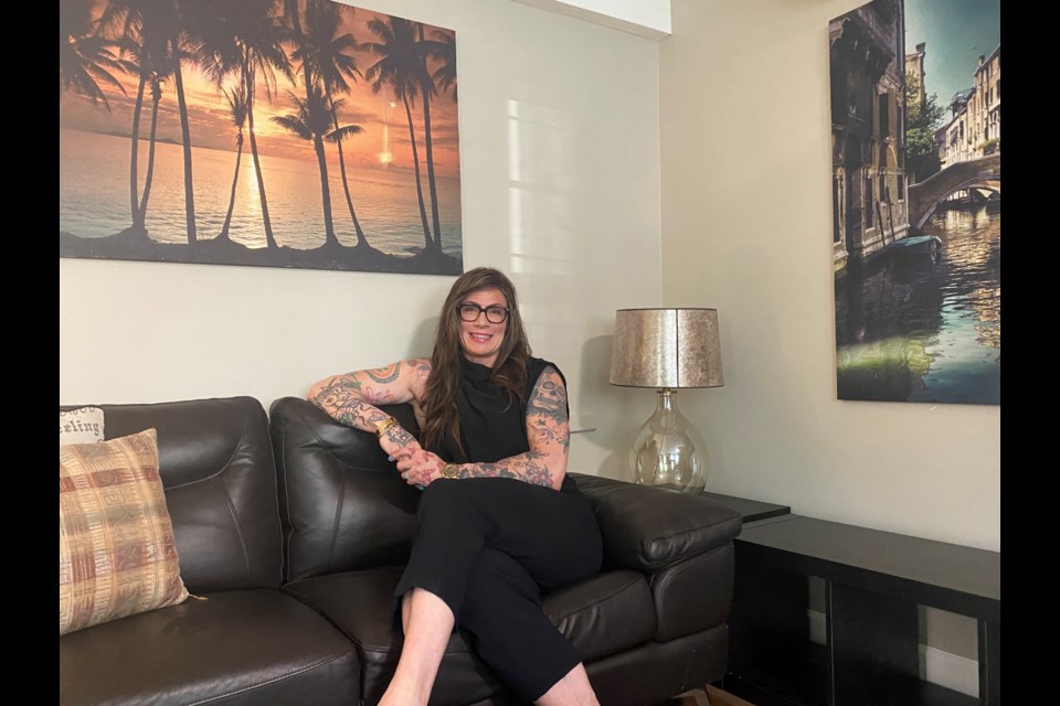 Arbe Mhyre takes a seat in one of the comfy rooms at the emergency family shelter in New West operated by Fraserside Community Services Society.