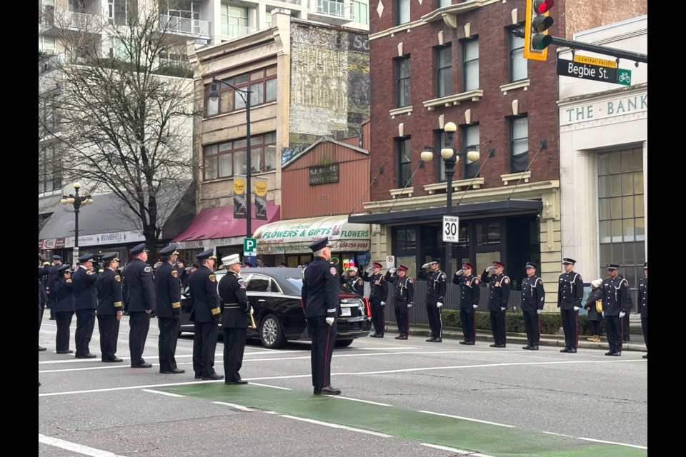 First responders lined a block of Columbia Street and offered a salute in honour of firefighter Dave Phillips.