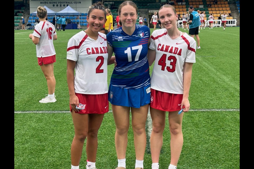 Lauren Black, Zola LeDonne and Beth Anderson, from left, post for a photo after the Canada/Italy match.