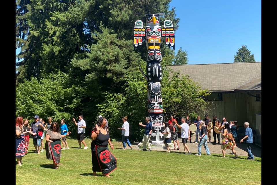 Friday's blessing of a totem pole in Queen's Park included drumming and dancing.