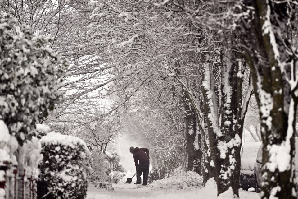 Residents in Burnaby Heights dig out after a snowstorm on February 2, 2025.