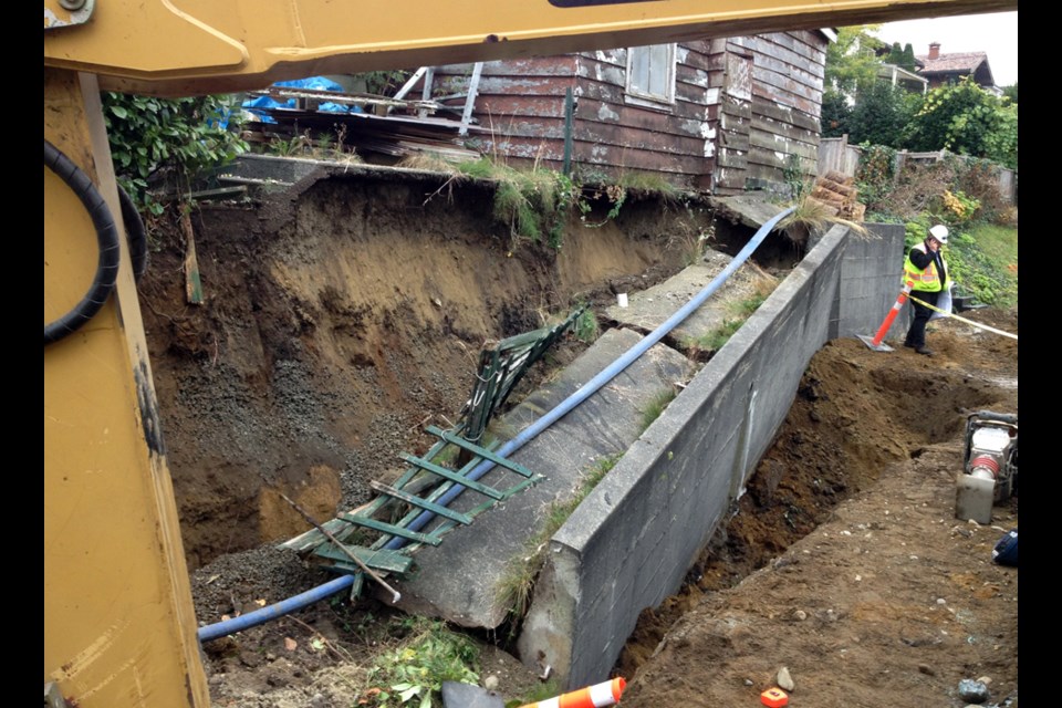 An evidence photo shows the aftermath of the North Burnaby concrete retaining wall collapse that killed 28-year-old pipe layer Jeff Caron in October 2012.