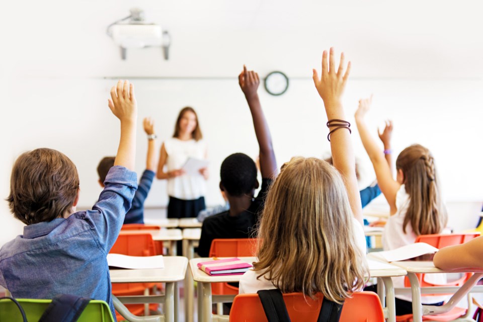 Students in full school classroom