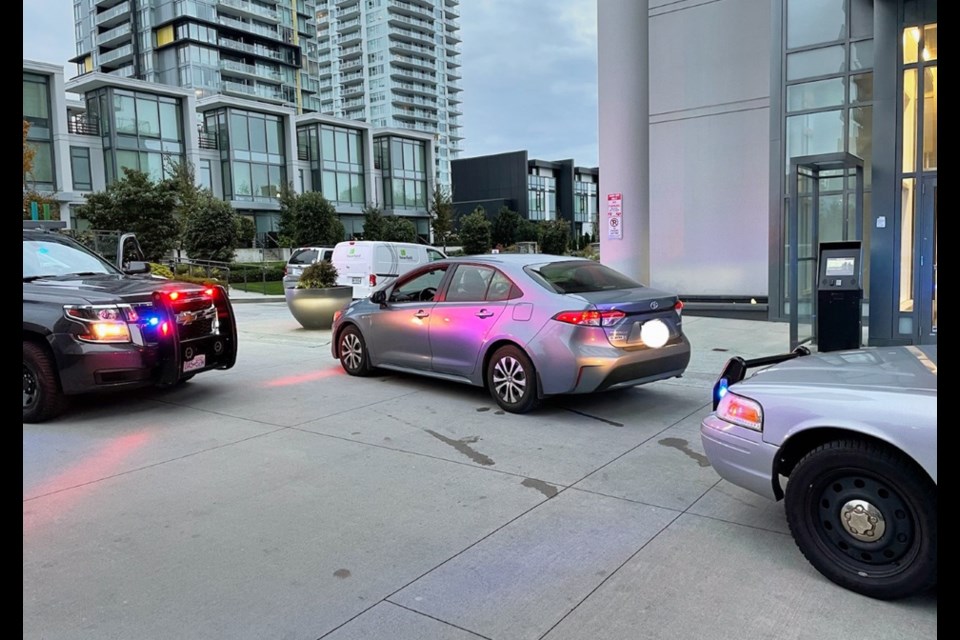 Police block-in an illegal ride hailing vehicle in Metrotown last week. 